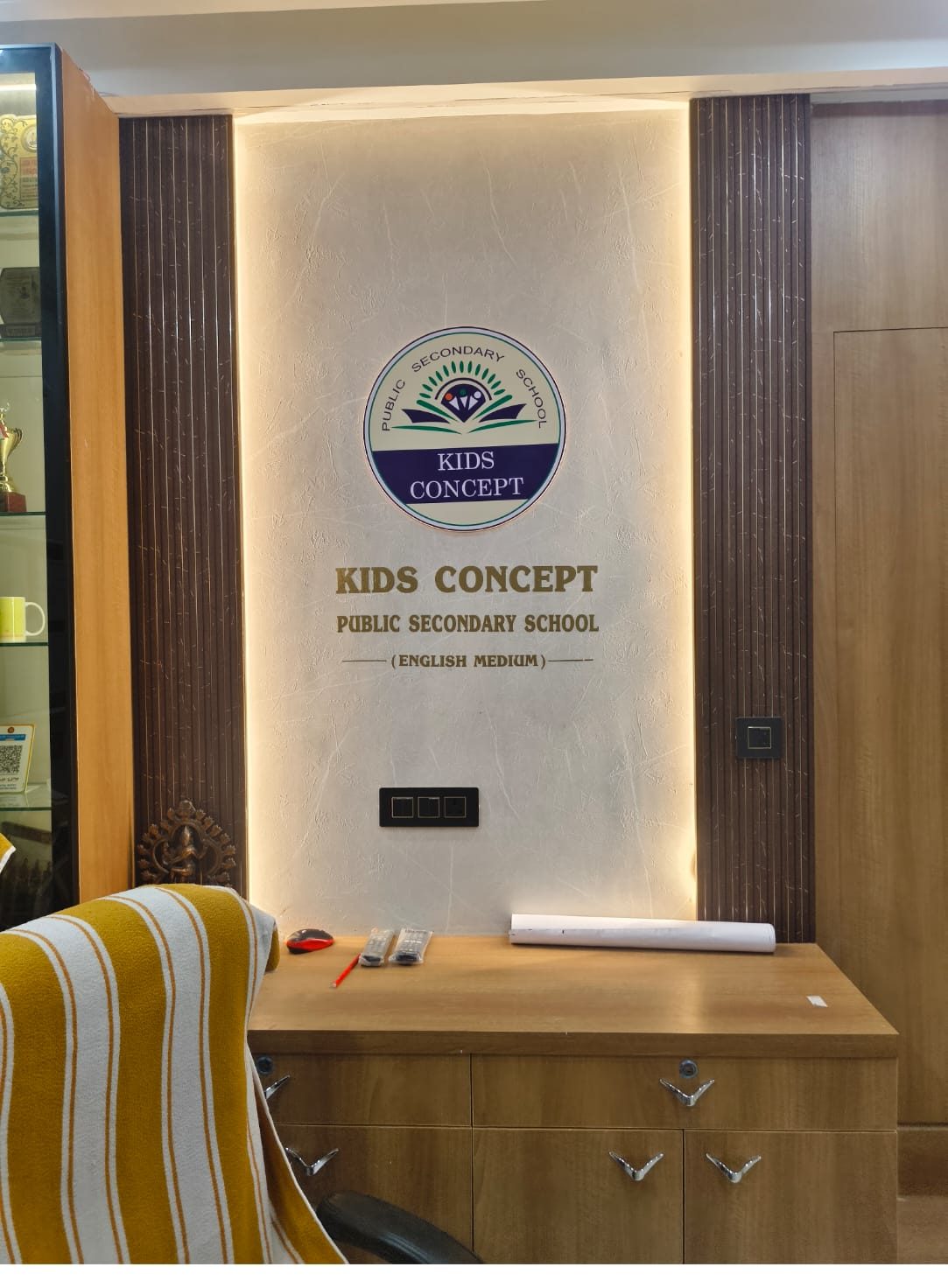 School reception branding — backlit 3D logo wall