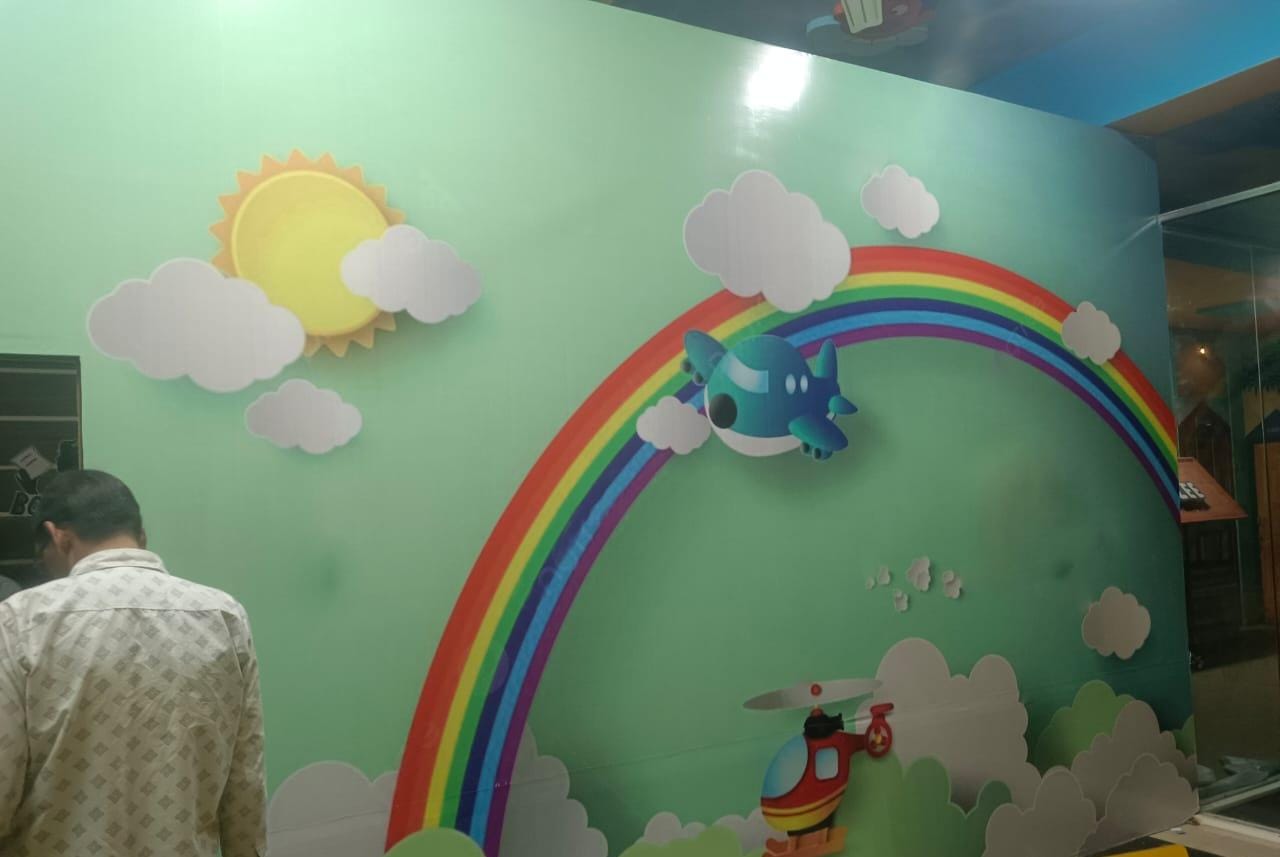 Rainbow & clouds kids room wall